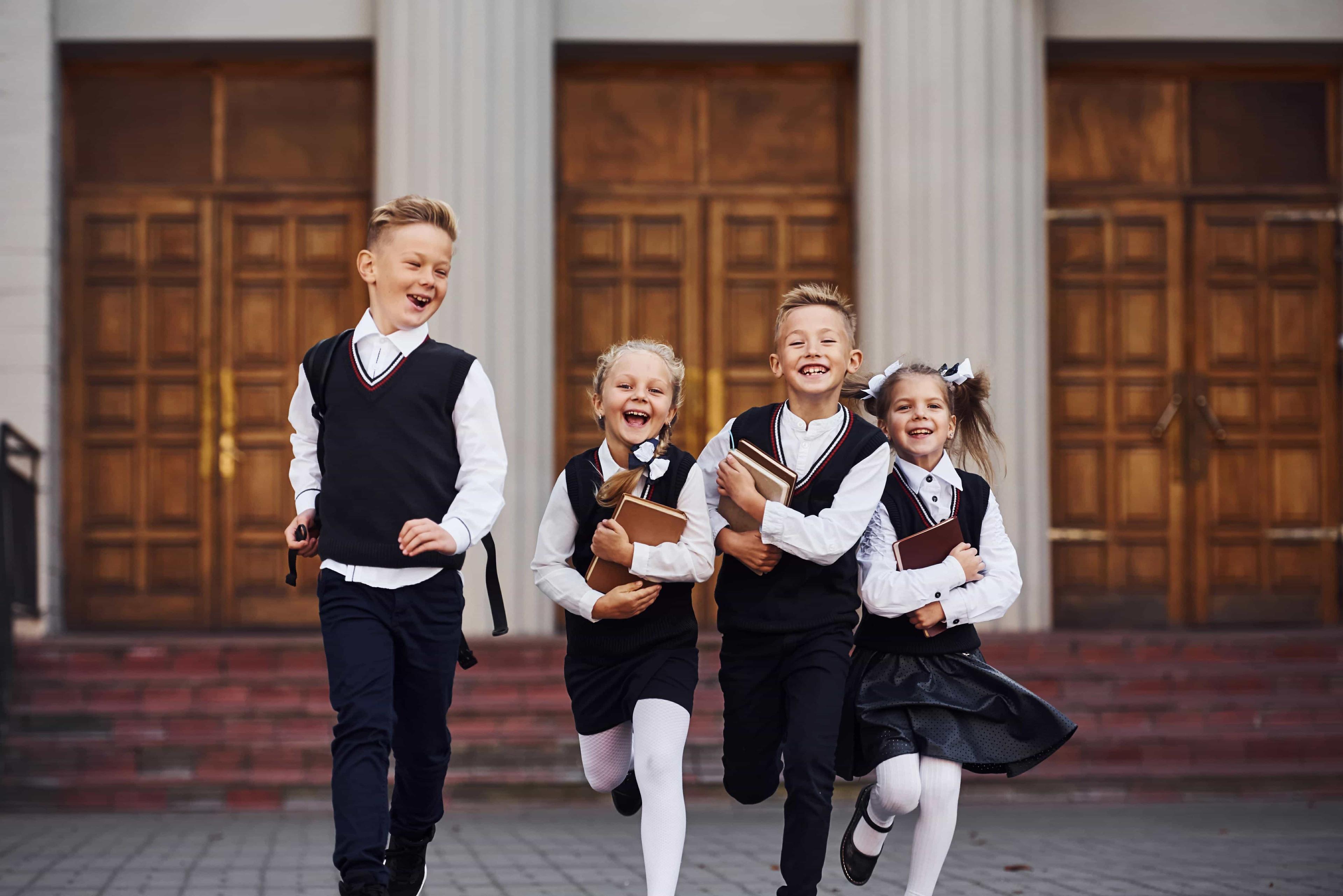 Young students stand in front of a prep school as they wiat for their tutoring to begin.