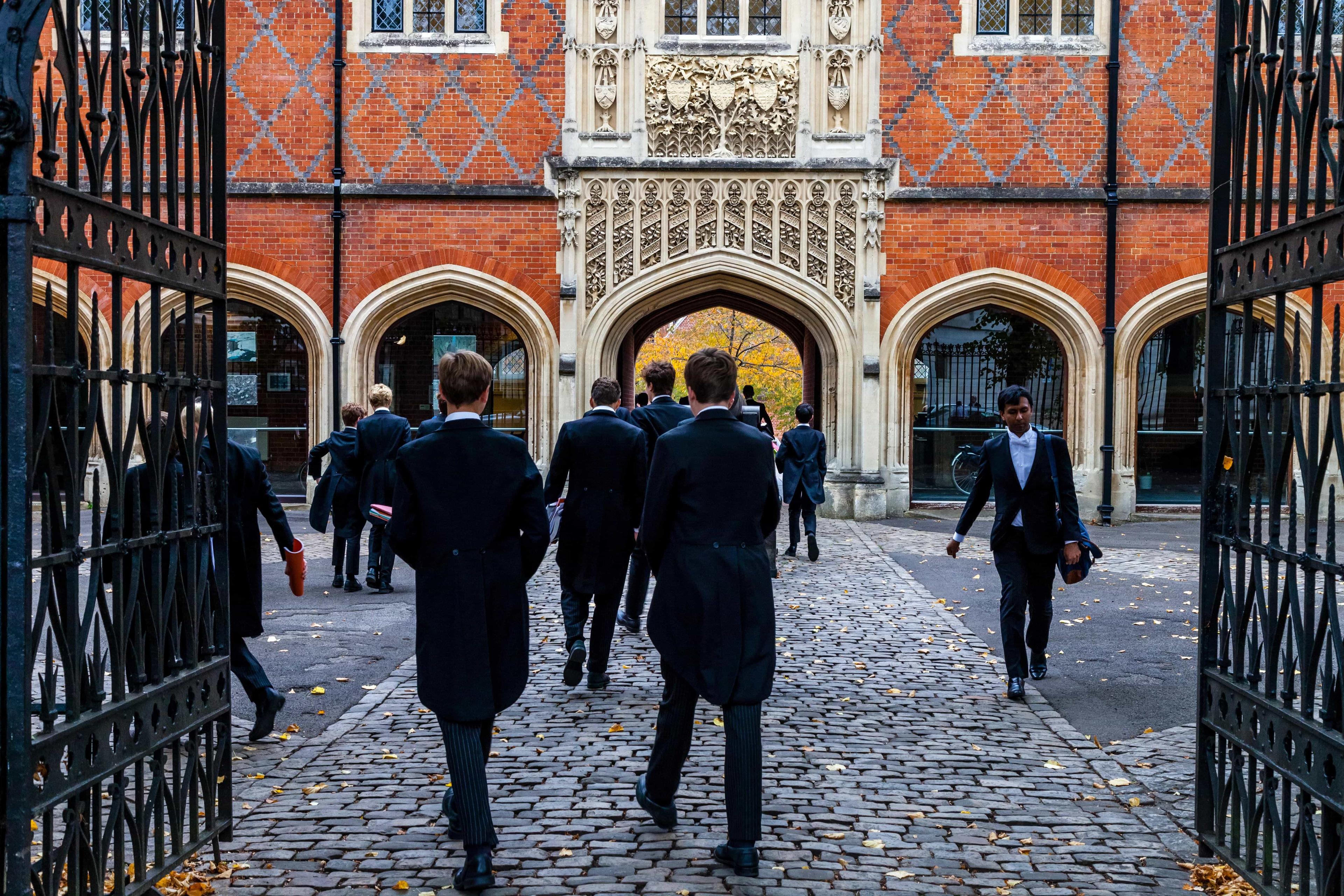 IGCSE and GCSE students at Harrow School walk between buildings as they head to their tutorials.