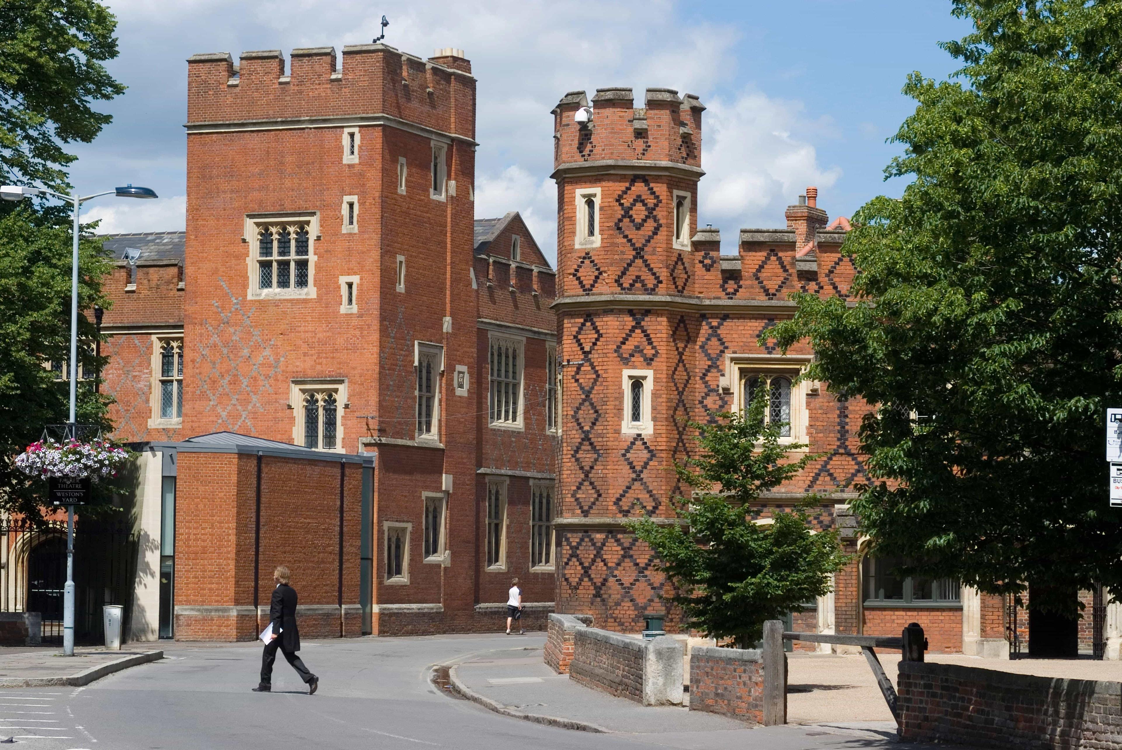 A historic, red brick school building belonging to Harrow School.